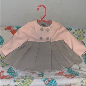 Adorable pink and gray lined infant coat.